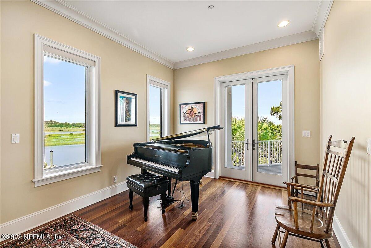 3425 Lands End Drive St. Augustine, FL 32084 - Photo 9 of 79 a living room with furniture and a wooden floor