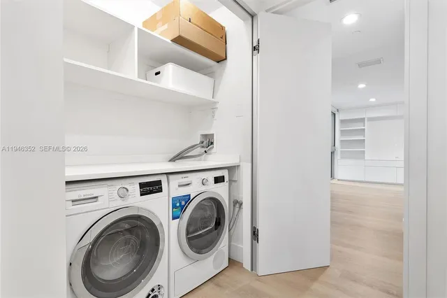 a utility room with dryer and washer