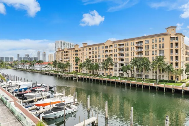 a view of a lake with a city skyline in the background