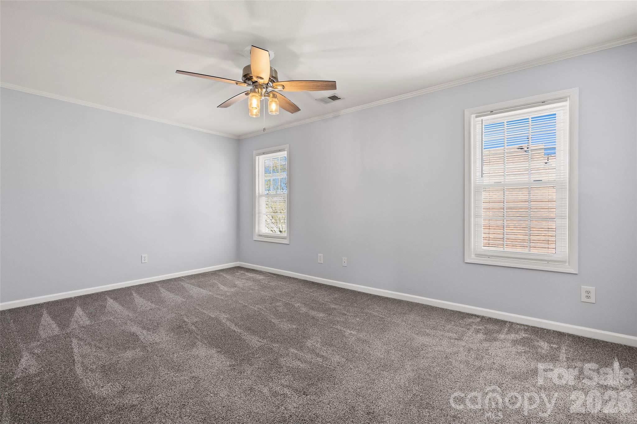 4485 Easywater Lane Fort Mill, SC 29707 - Photo 17 of 29 an empty room with windows and fan