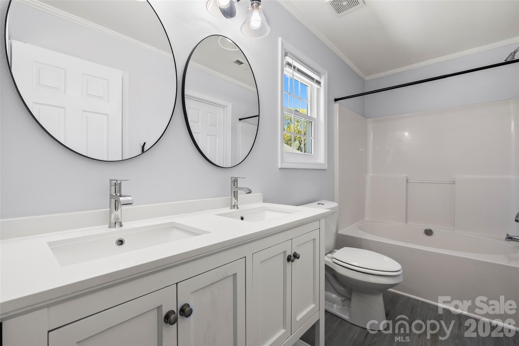 4485 Easywater Lane Fort Mill, SC 29707 - Photo 18 of 29 a bathroom with a sink a toilet and a mirror
