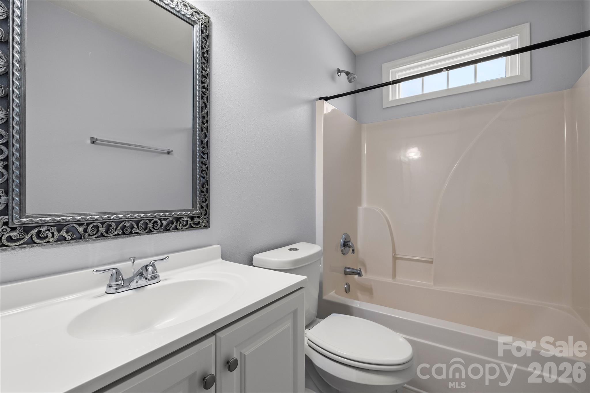 4485 Easywater Lane Fort Mill, SC 29707 - Photo 20 of 29 a bathroom with a sink toilet and shower