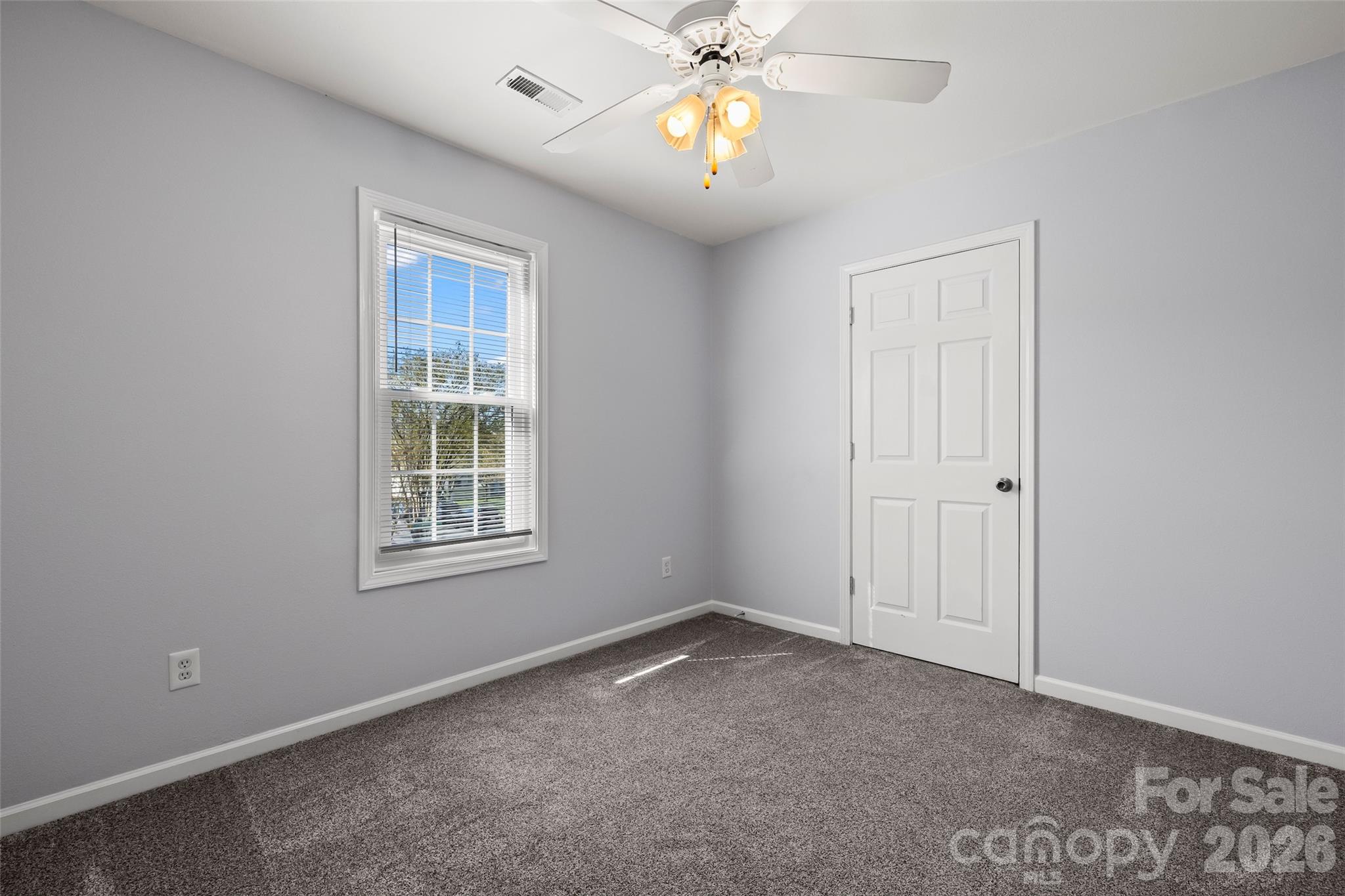 4485 Easywater Lane Fort Mill, SC 29707 - Photo 21 of 29 an empty room with windows and fan