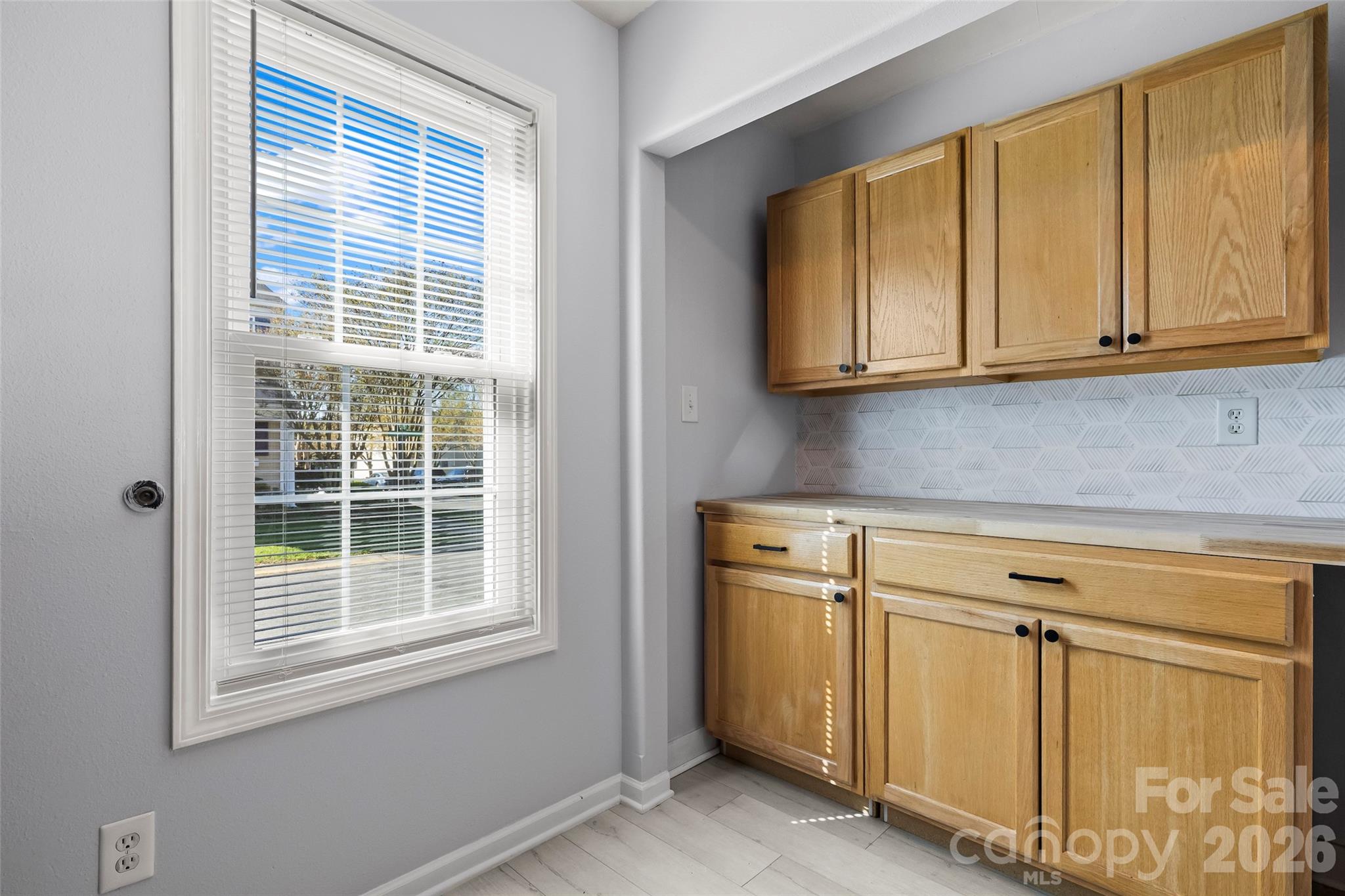4485 Easywater Lane Fort Mill, SC 29707 - Photo 9 of 29 a view of a kitchen with wooden cabinets