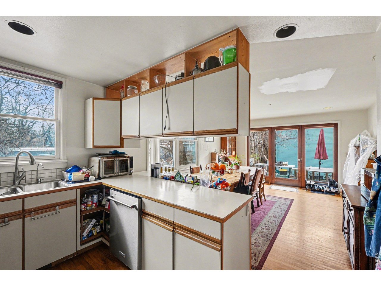623 Marine Street Boulder, CO 80302 - Photo 15 of 38 a kitchen with sink refrigerator and large window