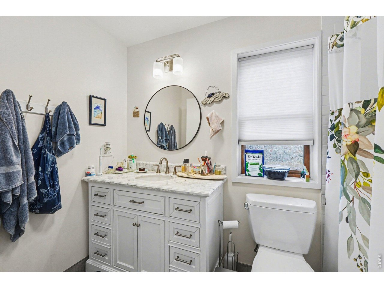 623 Marine Street Boulder, CO 80302 - Photo 29 of 38 a bathroom with a toilet sink and mirror