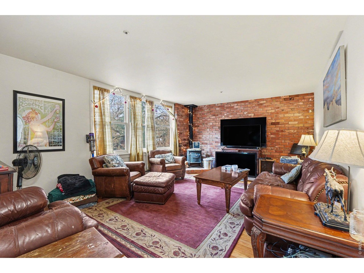 623 Marine Street Boulder, CO 80302 - Photo 7 of 38 a living room with furniture and a flat screen tv