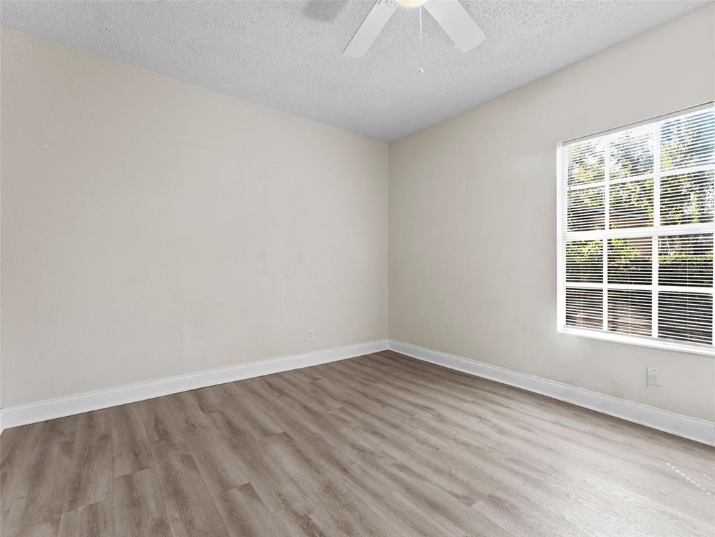 8210 North Klondyke Street, Unit 1 Tampa, FL 33604 - Photo 17 of 34 wooden floor in an empty room with a window