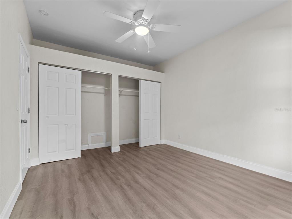 8210 North Klondyke Street, Unit 1 Tampa, FL 33604 - Photo 20 of 34 wooden floor in an empty room