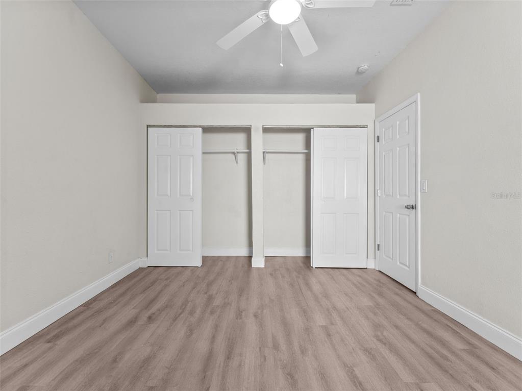 8210 North Klondyke Street, Unit 1 Tampa, FL 33604 - Photo 22 of 34 a view of an empty room with wooden floor