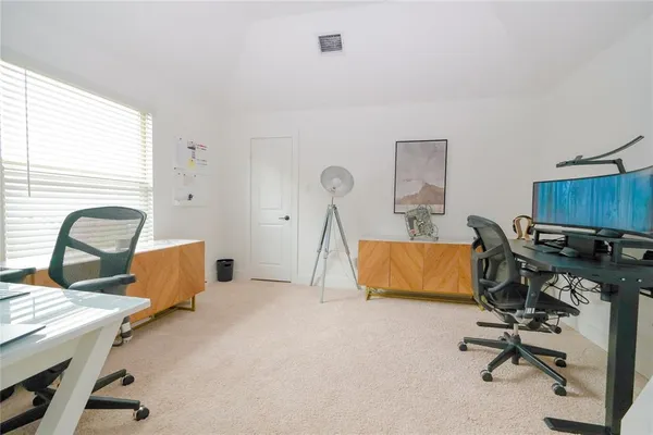 a workspace with furniture and a window