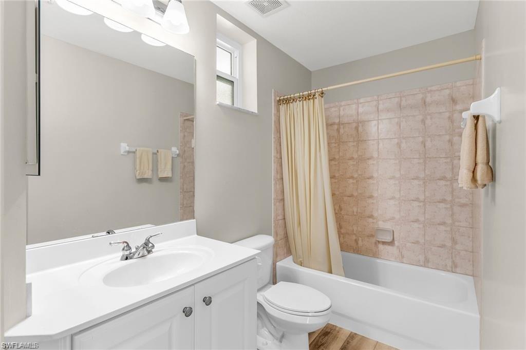 4705 Hawks Nest Way, Unit F101 Naples, FL 34114 - Photo 19 of 41 a bathroom with a sink a toilet and shower