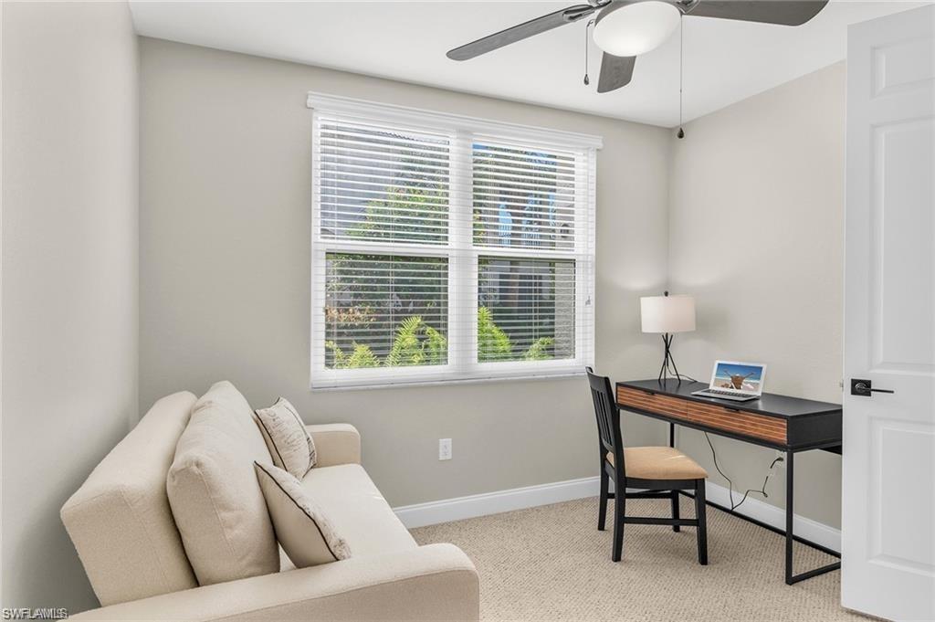 4705 Hawks Nest Way, Unit F101 Naples, FL 34114 - Photo 21 of 41 a living room with furniture and a window