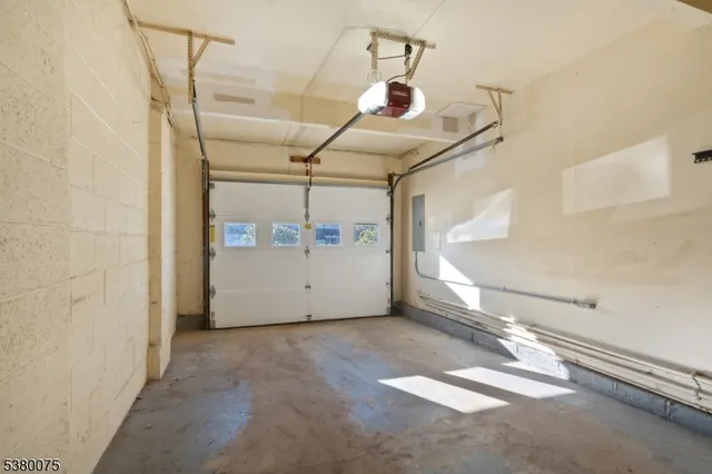 a chair and table sitting in front of a house