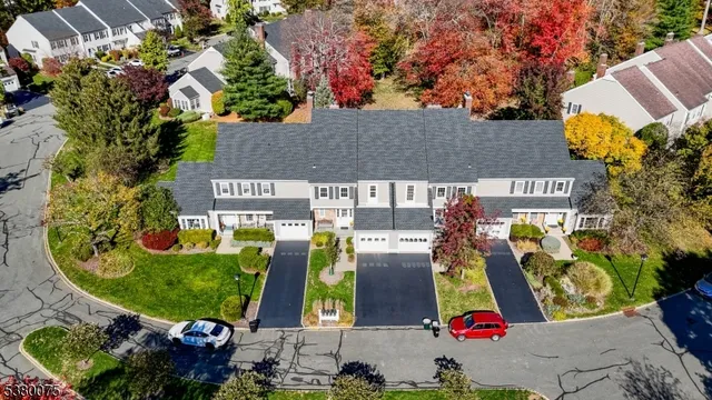 an aerial view of residential house with outdoor space and parking