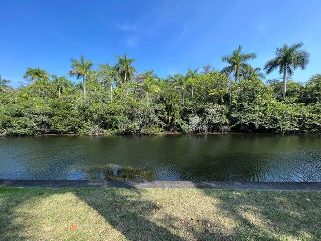 a view of a lake with a houses in the background