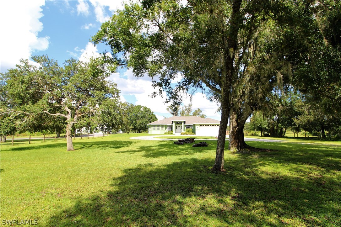 2771 Packinghouse Road Alva, FL 33920 - Photo 1 of 35 a view of an outdoor space and yard