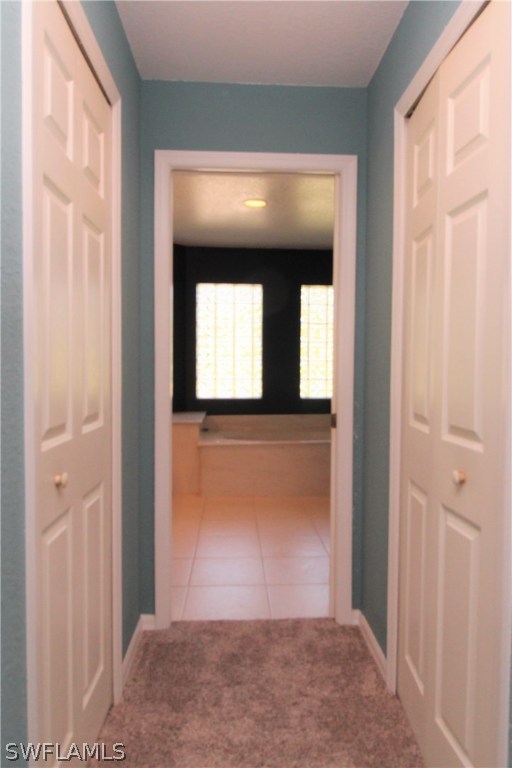 2771 Packinghouse Road Alva, FL 33920 - Photo 12 of 35 a view of a hallway with wooden floor and entryway