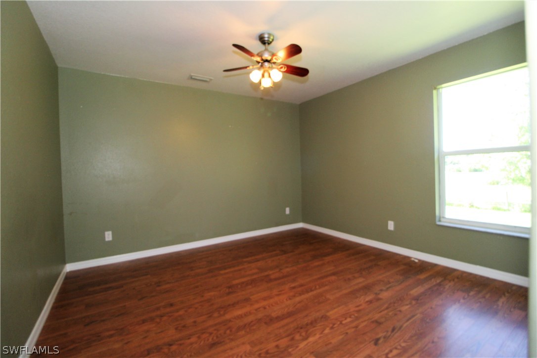2771 Packinghouse Road Alva, FL 33920 - Photo 29 of 35 an empty room with window and ceiling fan