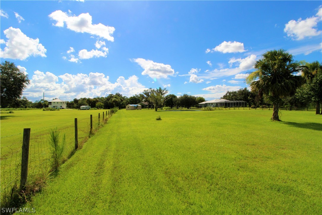 2771 Packinghouse Road Alva, FL 33920 - Photo 3 of 35 a view of a golf course with a lake