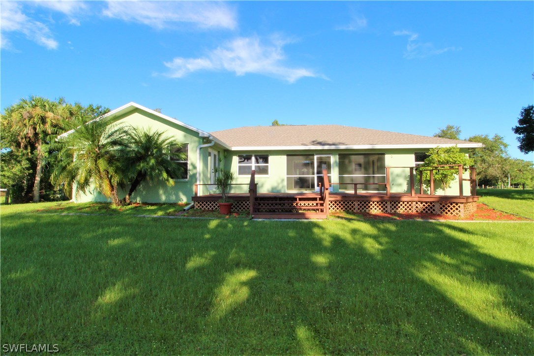 2771 Packinghouse Road Alva, FL 33920 - Photo 6 of 35 a view of a house with a backyard porch and sitting area