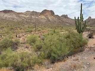 a view of a mountain with a mountain in the background