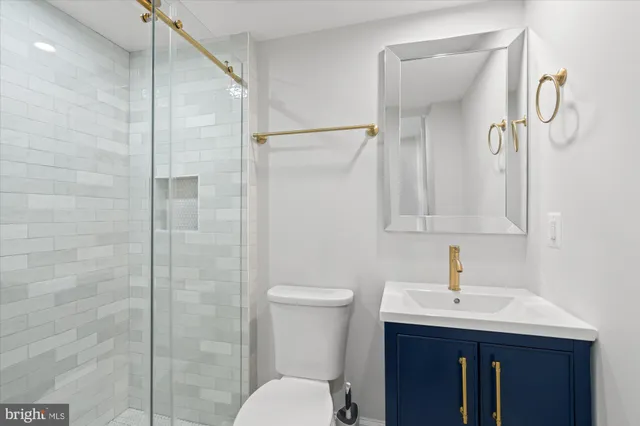 a kitchen with appliances a sink and cabinets