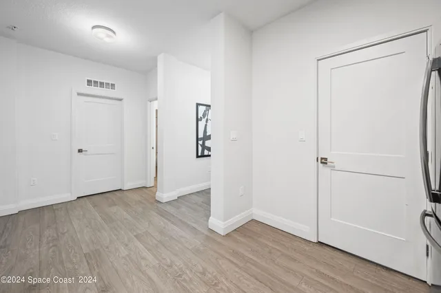a spacious bathroom with a double vanity sink and mirror