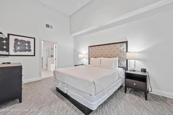 a living room with a bed and furniture