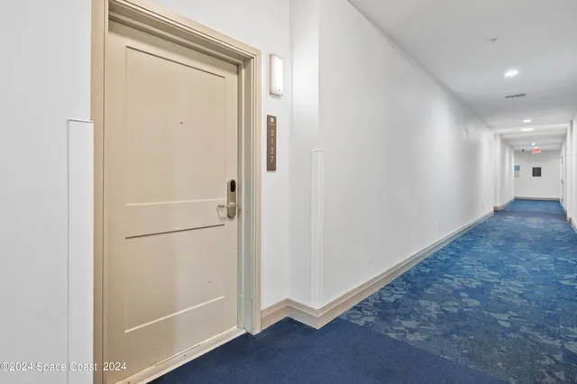 a view of a hallway with closet