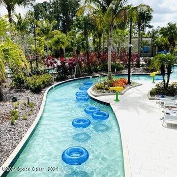 a view of a backyard with plants and patio