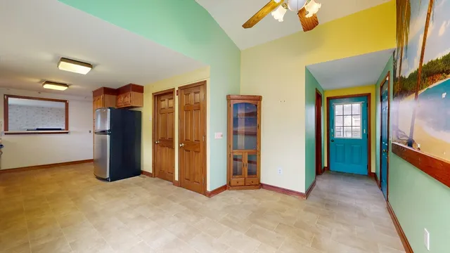 a view of an empty room with a fireplace