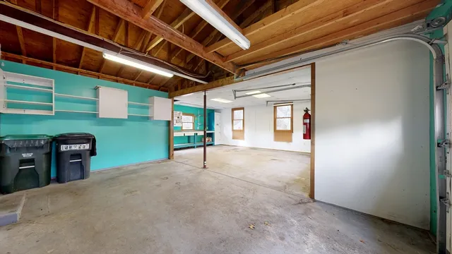 a view of empty room with wooden ceiling