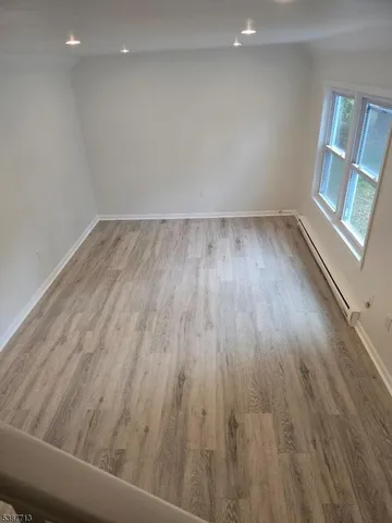 a view of wooden floor in an empty room