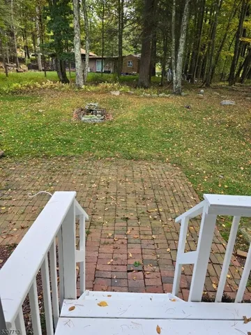 a backyard of a house with lots of green space