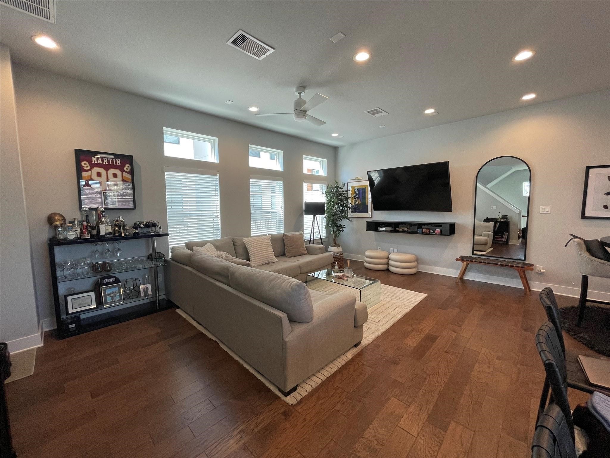 902 Martin Street, Unit A Houston, TX 77018 - Photo 2 of 21 a living room with furniture and a flat screen tv