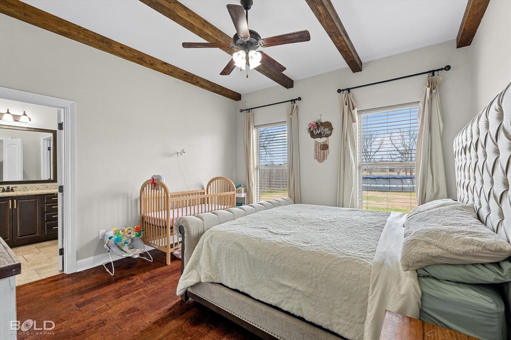 946 Maize Street Bossier City, LA 71111 - Photo 29 of 39 a bedroom with a bed couch and a large window