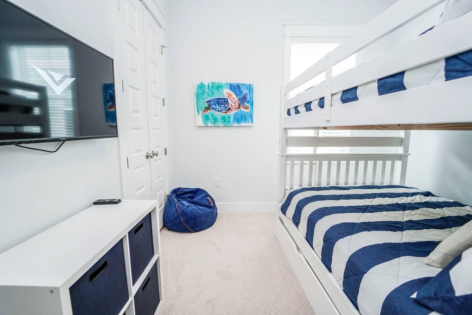 88 West W Pine, Unit A Inlet Beach, FL 32461 - Photo 11 of 19 a bedroom with a bed and a flat screen tv