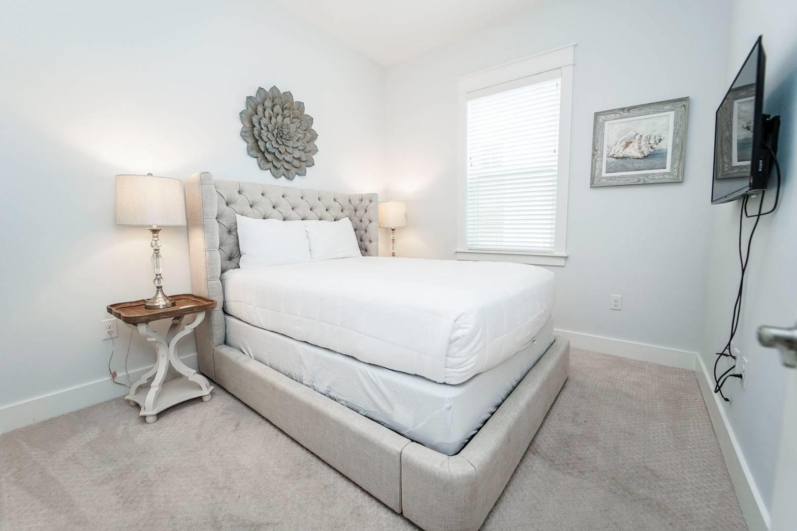 88 West W Pine, Unit A Inlet Beach, FL 32461 - Photo 12 of 19 a bedroom with a bed and a night stand