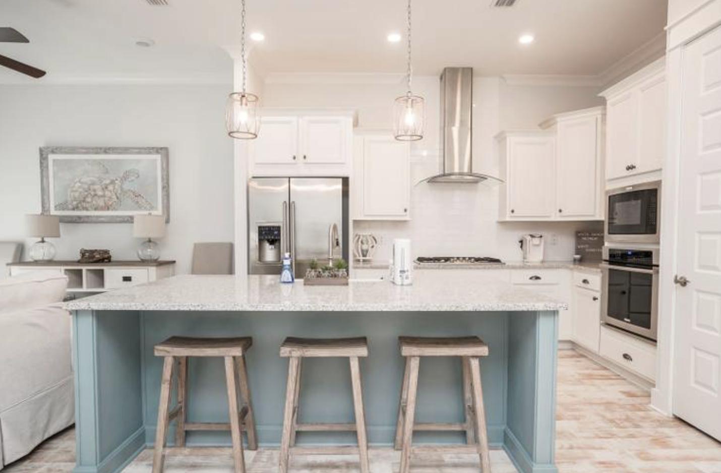 88 West W Pine, Unit A Inlet Beach, FL 32461 - Photo 2 of 19 a kitchen with kitchen island granite countertop a sink cabinets and stainless steel appliances