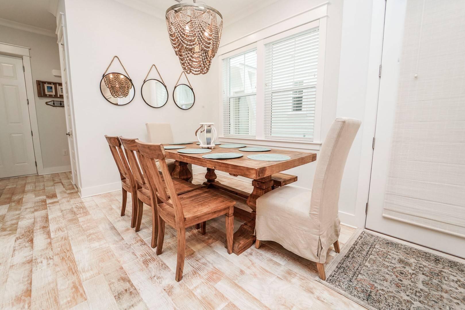 88 West W Pine, Unit A Inlet Beach, FL 32461 - Photo 4 of 19 a dining room with a wooden table and chairs