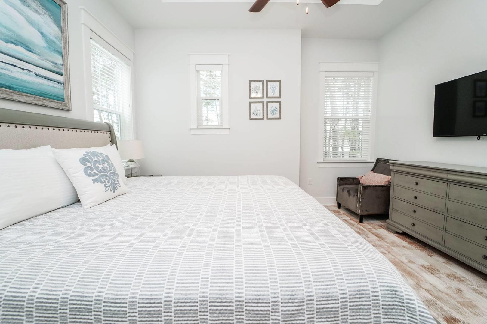 88 West W Pine, Unit A Inlet Beach, FL 32461 - Photo 8 of 19 a bedroom with a bed and a flat screen tv