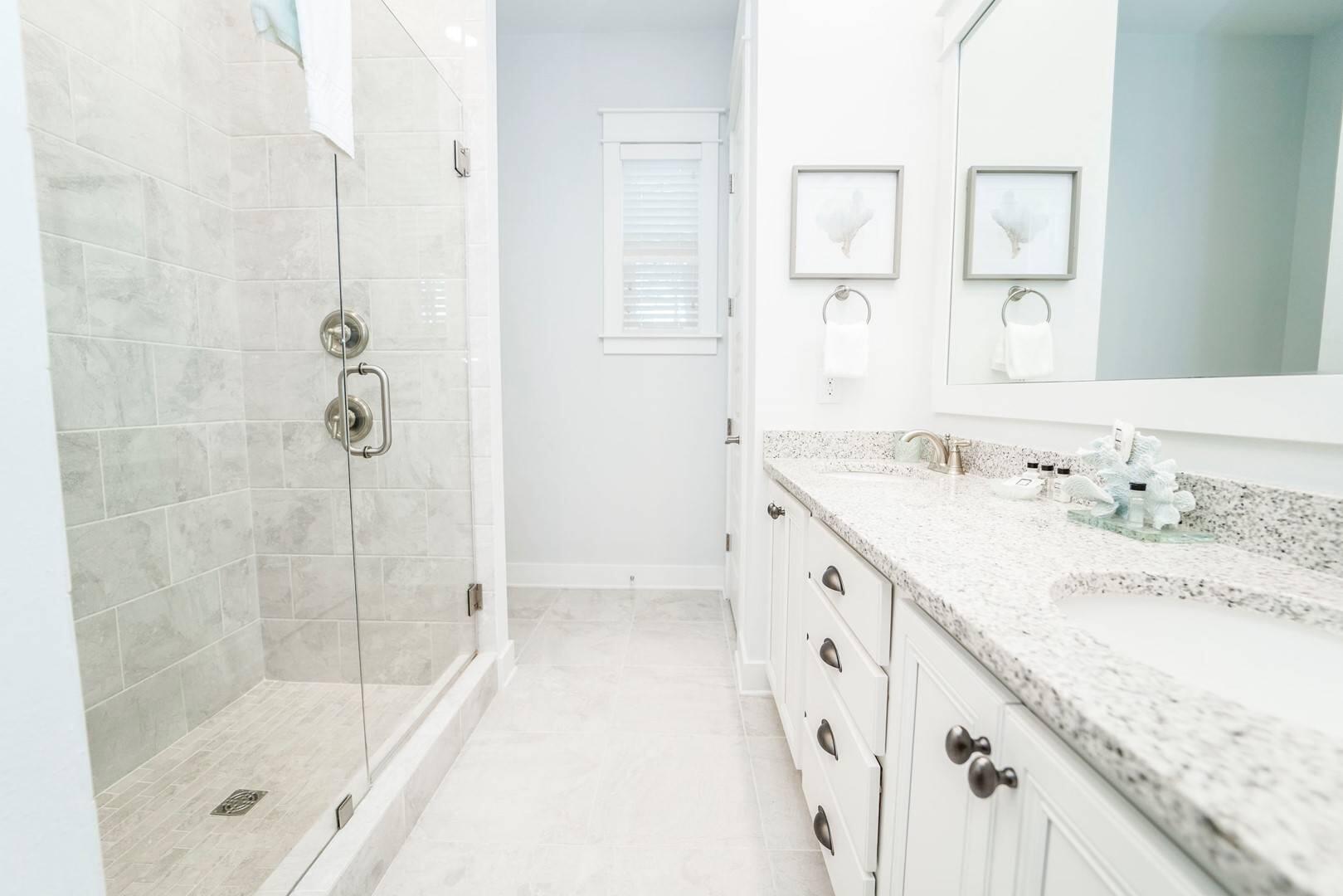88 West W Pine, Unit A Inlet Beach, FL 32461 - Photo 9 of 19 a bathroom with a granite countertop sink a shower and a mirror