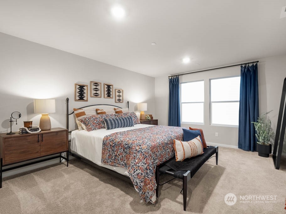4229 Pronghorn Place, Unit 20 Bremerton, WA 98310 - Photo 14 of 21 a bedroom with a bed and a large window