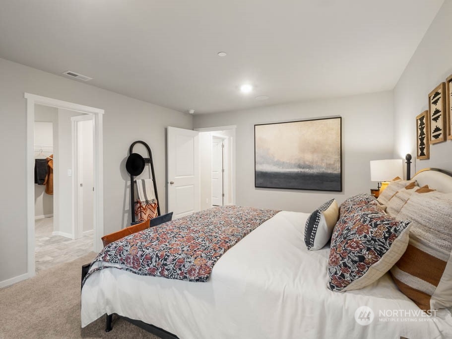4229 Pronghorn Place, Unit 20 Bremerton, WA 98310 - Photo 15 of 21 a bedroom with a bed and a large mirror