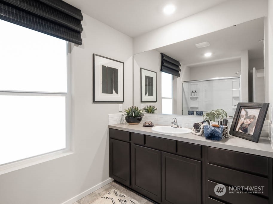 4229 Pronghorn Place, Unit 20 Bremerton, WA 98310 - Photo 16 of 21 a bathroom with a sink and a mirror