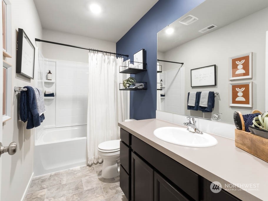 4229 Pronghorn Place, Unit 20 Bremerton, WA 98310 - Photo 18 of 21 a bathroom with a sink a toilet and shower