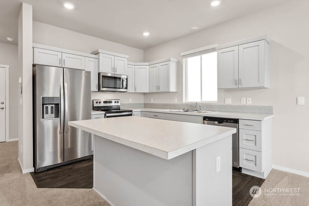 4229 Pronghorn Place, Unit 20 Bremerton, WA 98310 - Photo 2 of 21 a kitchen with a refrigerator stove and microwave