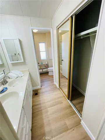 a bathroom with a sink a mirror and a toilet