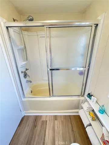 a bathroom with a tub and a shower